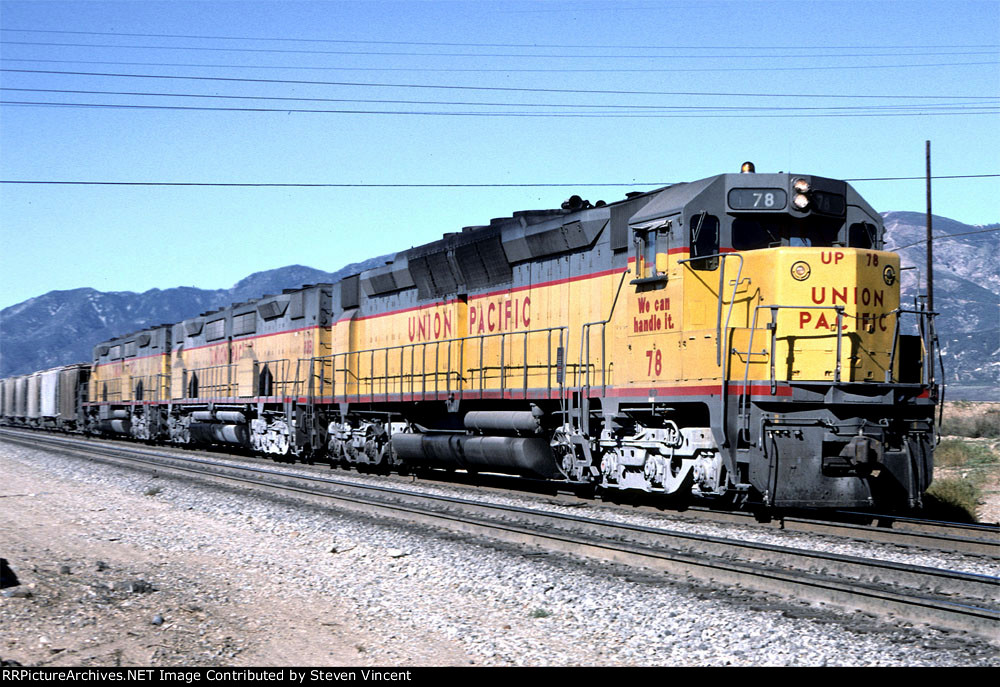 Union Pacific WB with DDA40X #78. Large cement pickup from Victorville area on head end.